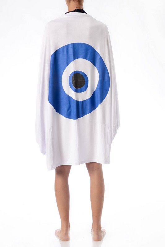 woman on her swimsuit wearing greek white pareo with evil eye from behind